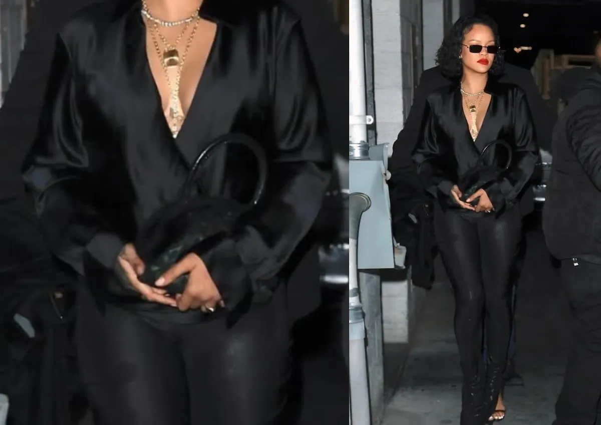 Wearing a black top and pants, Rihanna exits a dinner in Beverly Hills