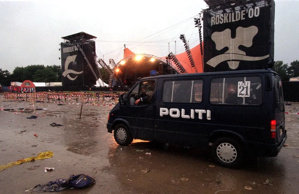 A police van patrols the grounds of the Roskilde music festival in 2000 following a fatal incident during the Pearl Jam concert