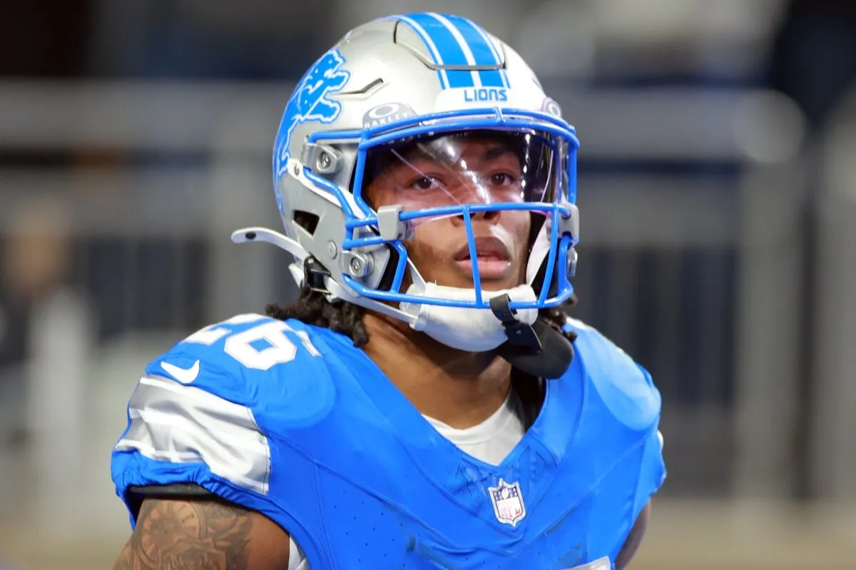 Running back Jahmyr Gibbs of the Detroit Lions on the field after a play during a game against the Jacksonville Jaguars