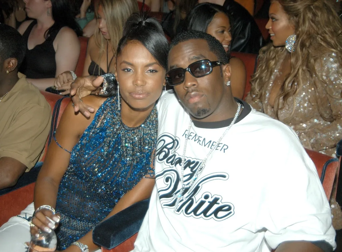 Sean 'Diddy' Combs puts his arm around Kim Porter during the 2003 MTV Video Music Awards