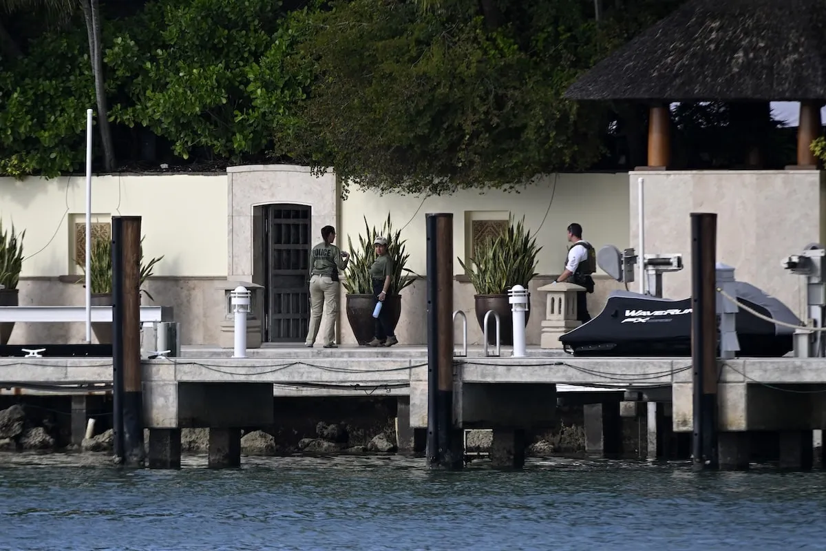 Police and Homeland Security officers are seen at the waterfront mansion of Sean Combs aka Diddy in Miami during a bi-coastal raid