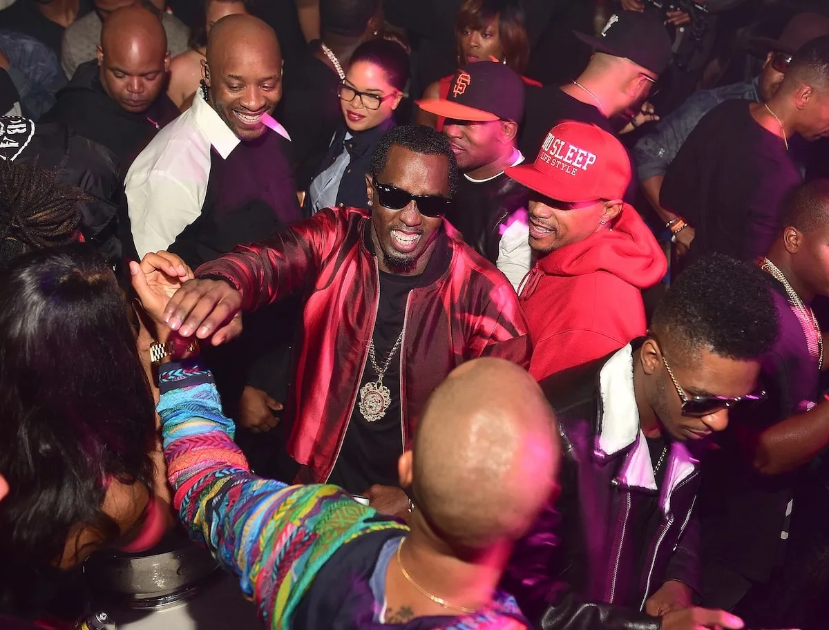 Bodyguard Roger Bonds watches over Diddy at an afterparty in Atlanta in 2015