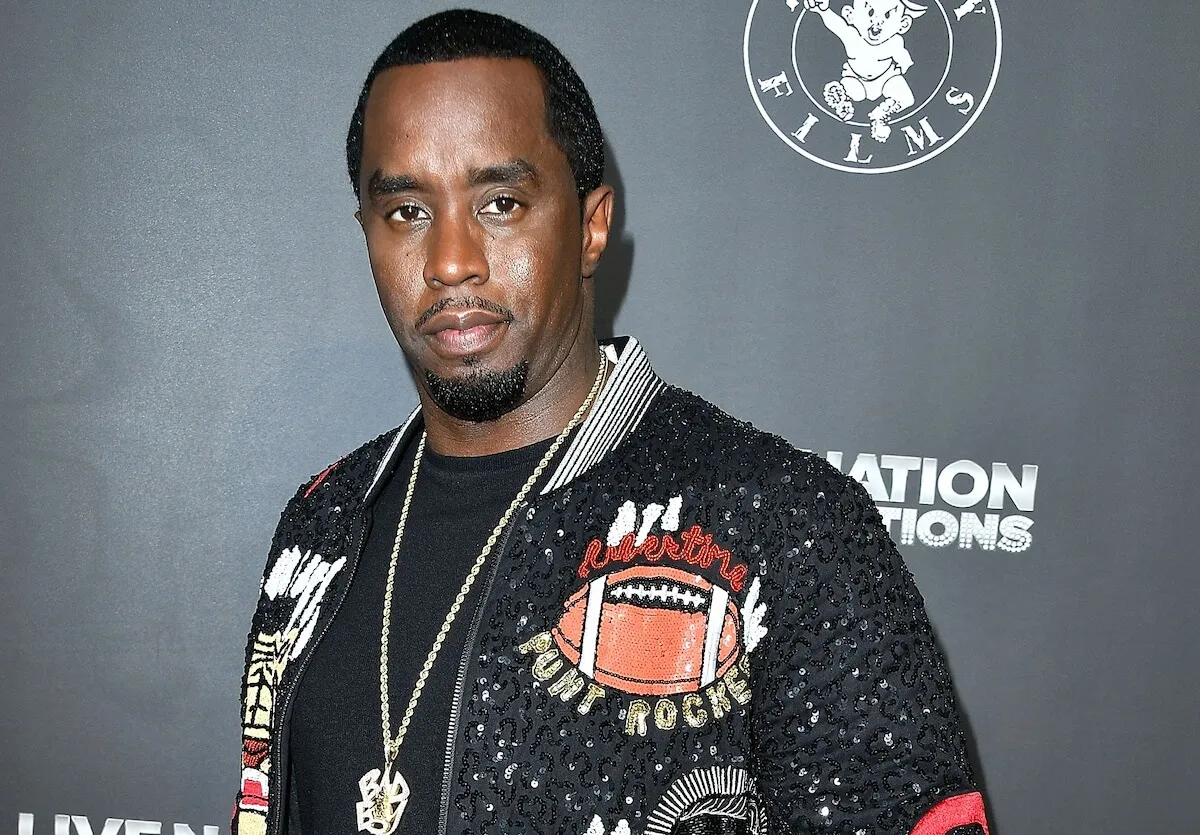 Sean 'Diddy' Combs wears a sequined jacket with icons on it.