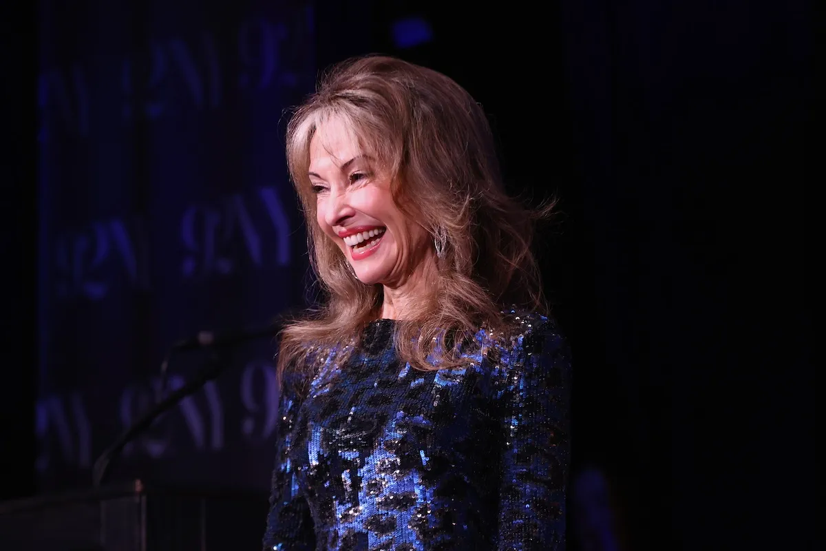 Smiling Susan Lucci in blue and black dress