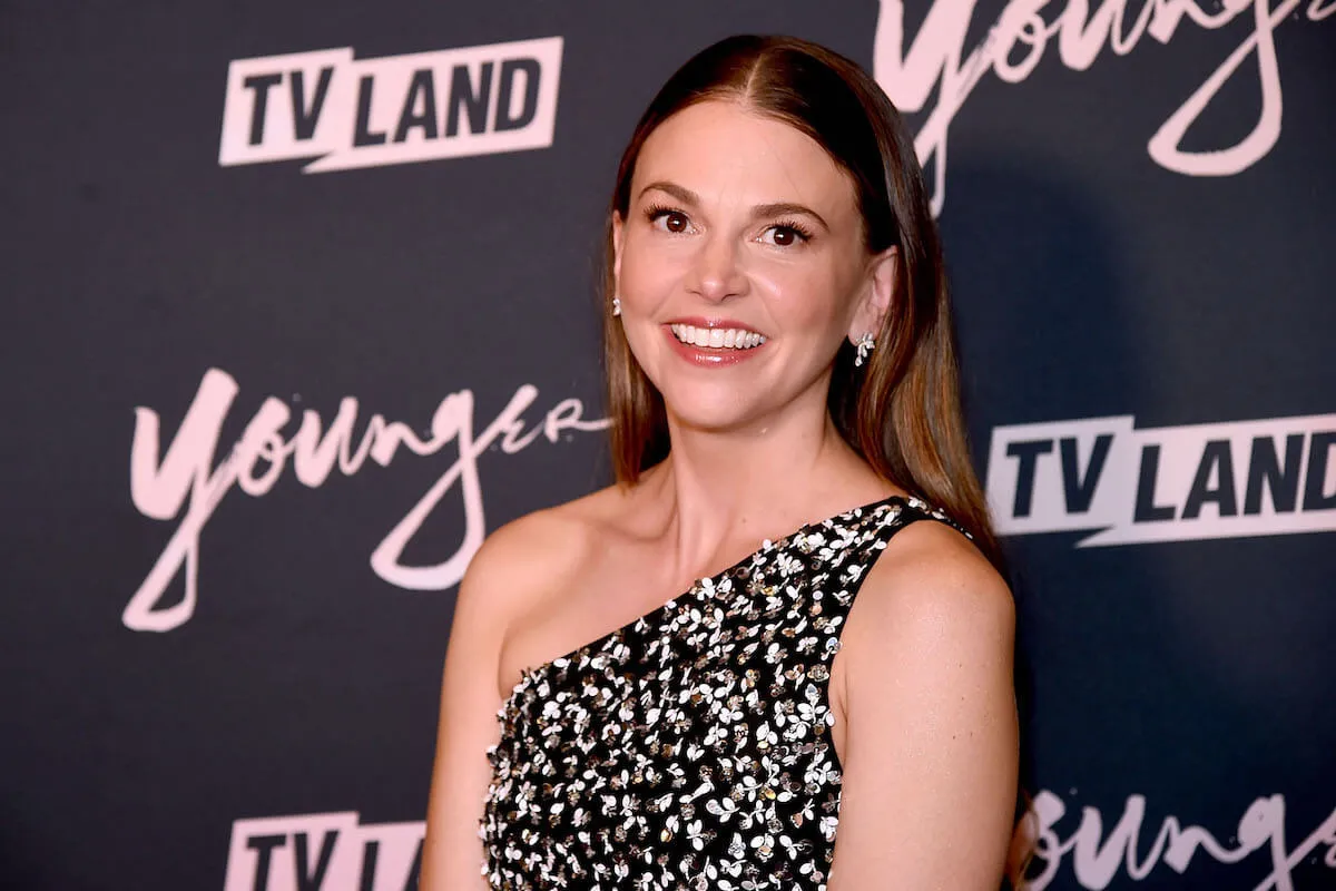 Sutton Foster smiles wearing a one-shoulder dress at the 'Younger' Season 5 premiere