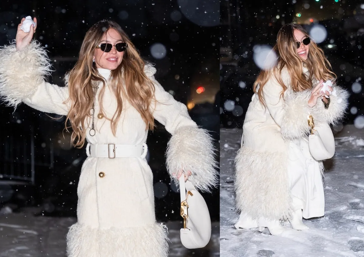 Wearing a white shearling coat, Sydney Sweeney throws a snowball at paparazzi in NYC