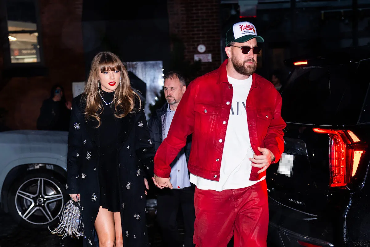 Taylor Swift and Travis Kelce, who have rules for eating at restaurants, in 2024 holding hands