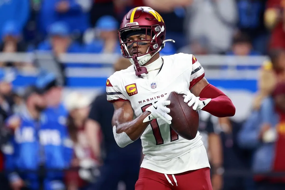 Terry McLaurin of the Washington Commanders runs after making a catch ahead of an NFL Divisional Round game against the Detroit Lions