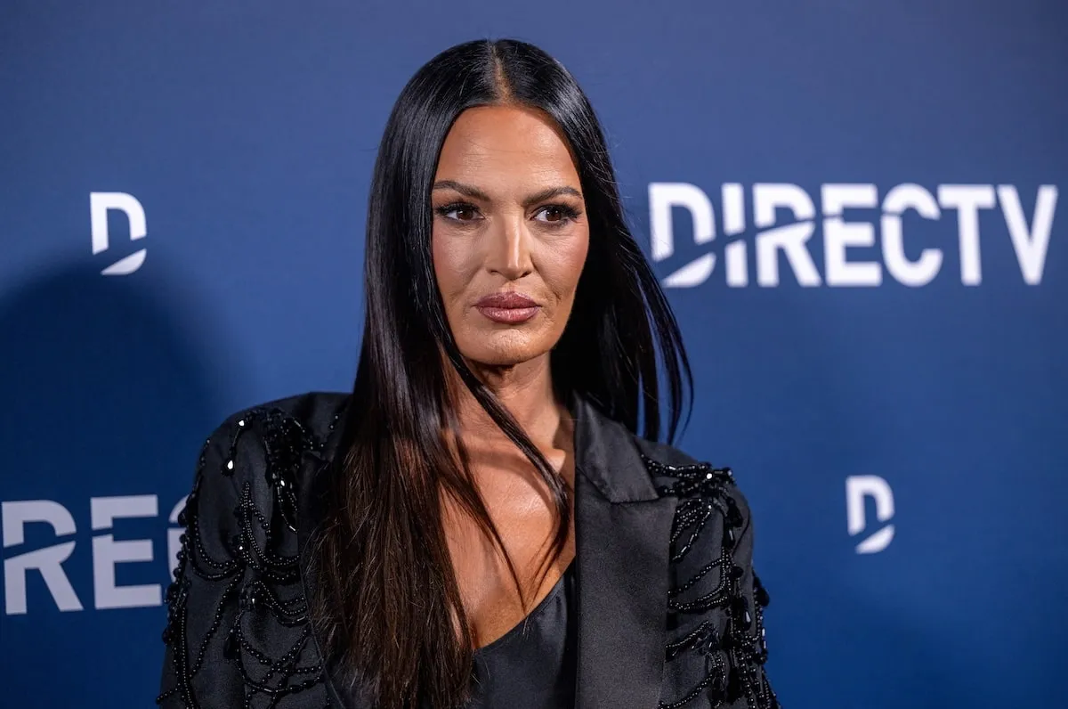 TV personality Lisa Barlow poses for photos on the red carpet in a black outfit