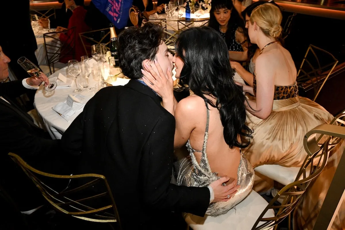 Sitting at their 2025 Golden Globes table, Timothée Chalamet and Kylie Jenner kiss