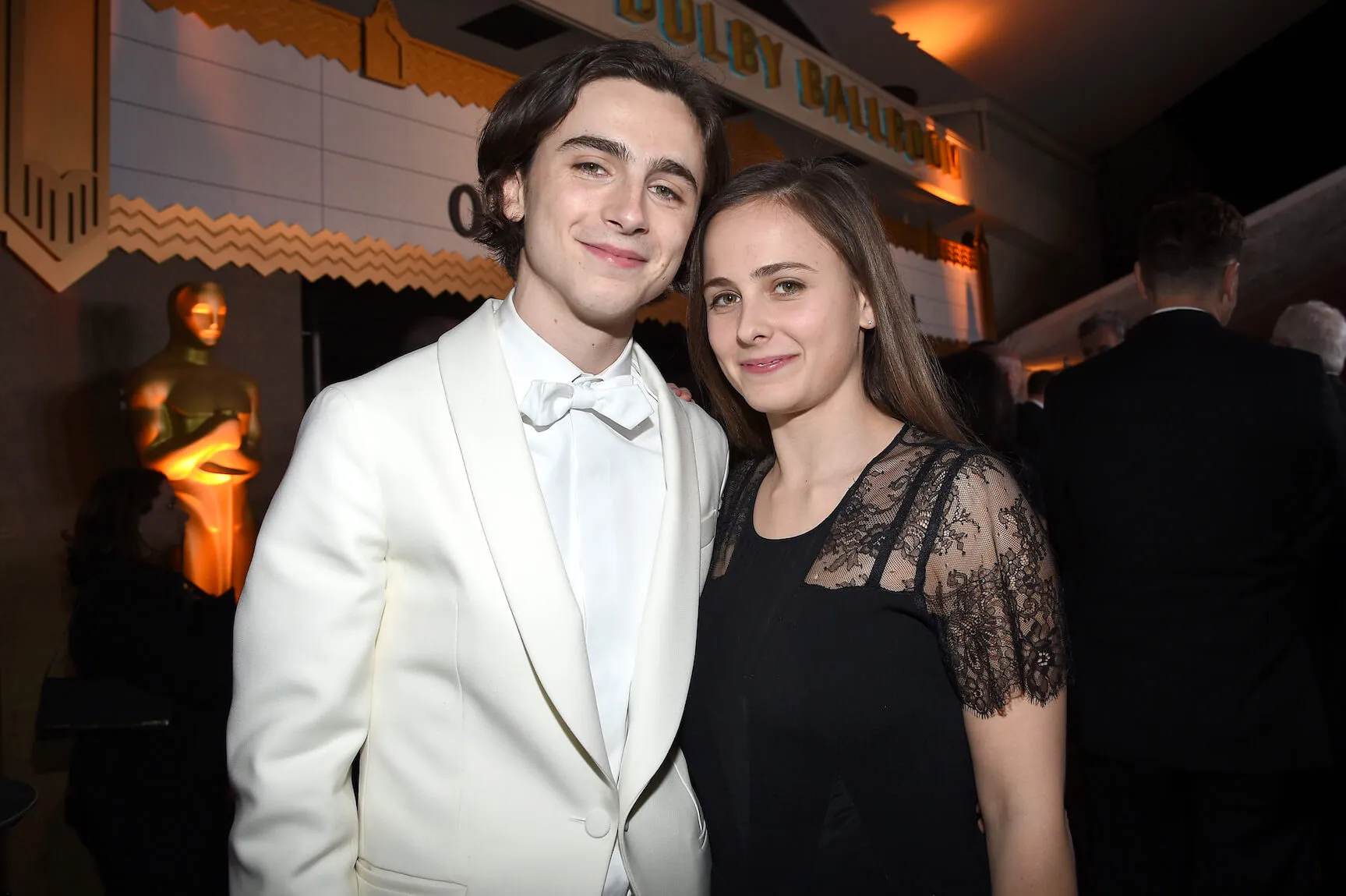 Timothée Chalamet and sister Pauline Chalamet posing with each other in formal attire in 2018