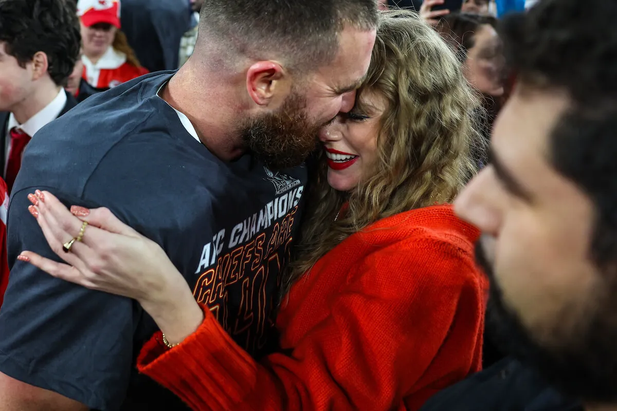 Travis Kelce and Taylor Swift embrace after the Chiefs AFC win