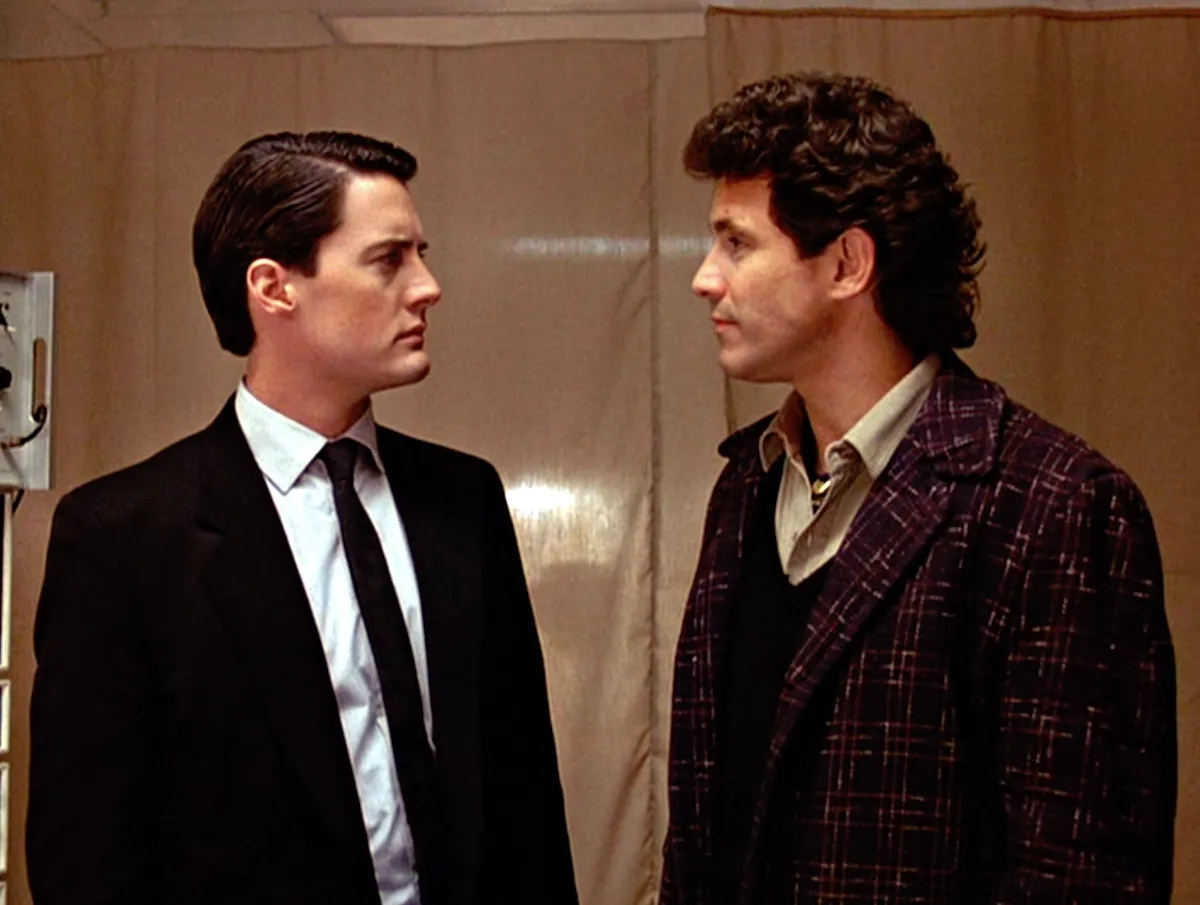 Dale Cooper and Harry Truman looking at each other in a still from 'Twin Peaks'