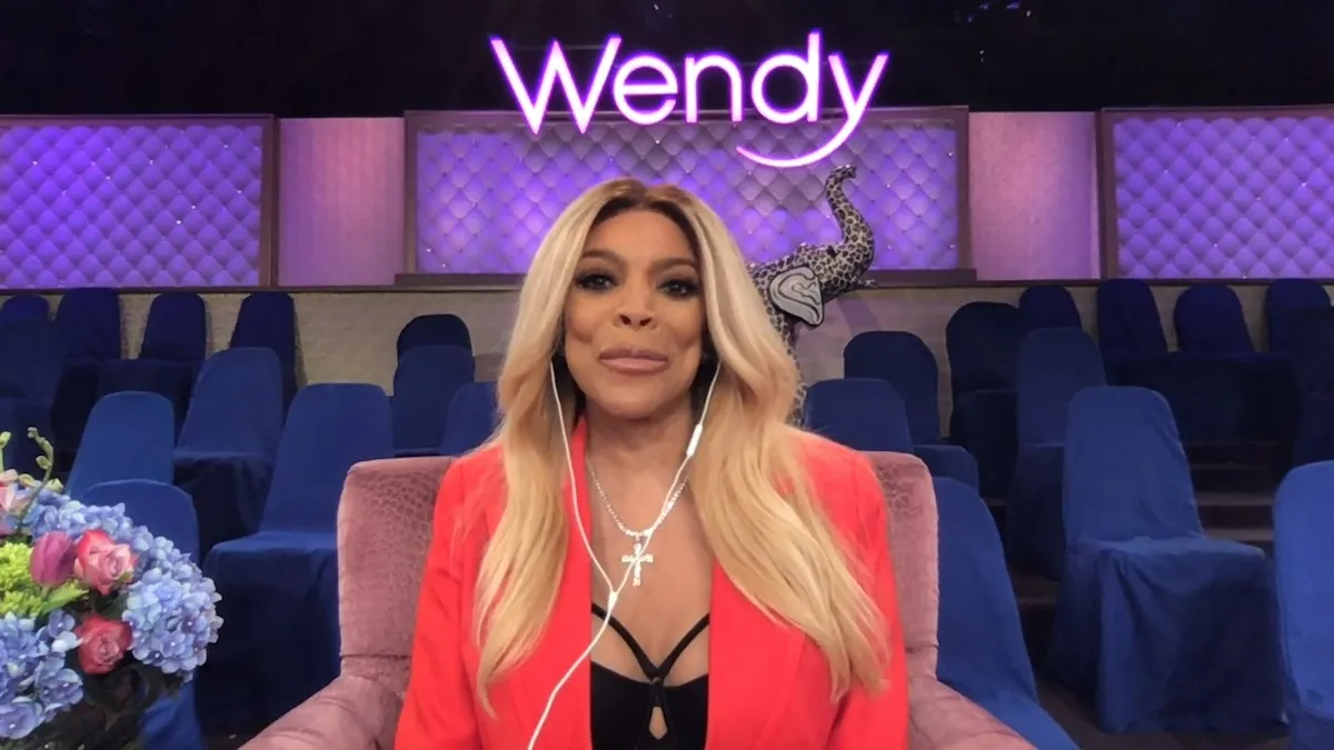 Wendy Williams wearing a red jacket