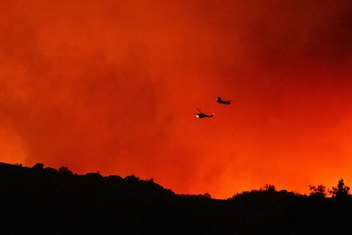 Views as the Palisades fire burn towards Mulholland Dr and the 405 freeway on January 10, 2025 in Los Angeles, California