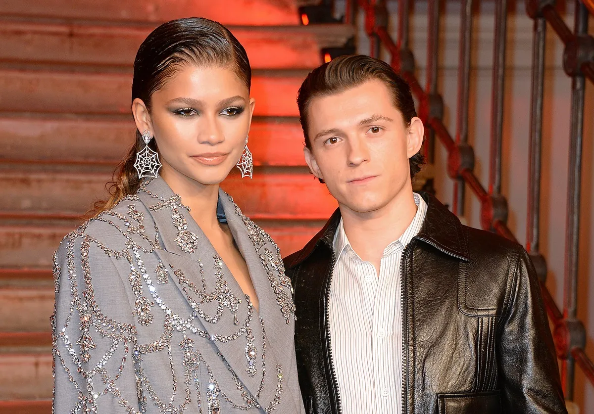 Zendaya and Tom Holland pose at a photocall for "Spider-Man: No Way Home" at The Old Sessions House on December 5, 2021 in London, England.