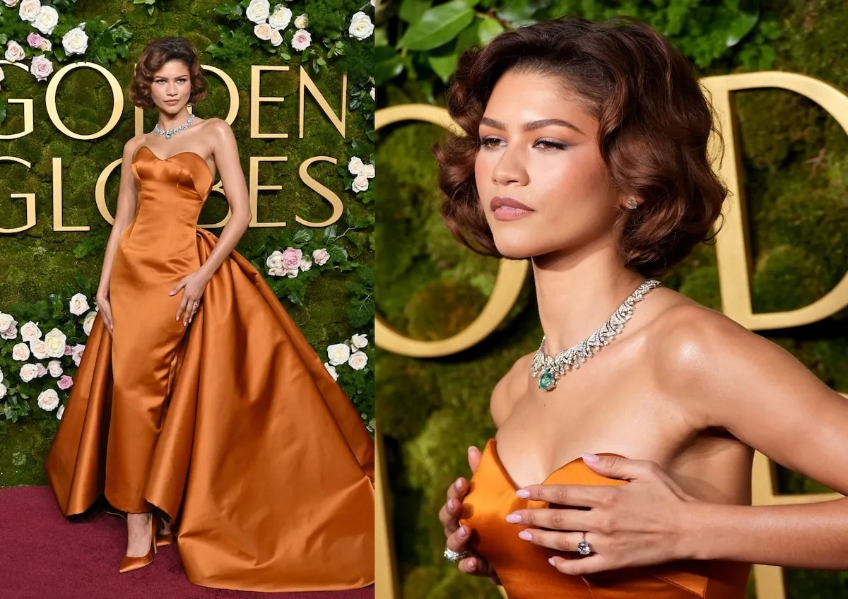 Wearing an orange dress, Zendaya poses on the red carpet in an orange Louis Vuitton dress while wearing her engagement ring from Tom Holland