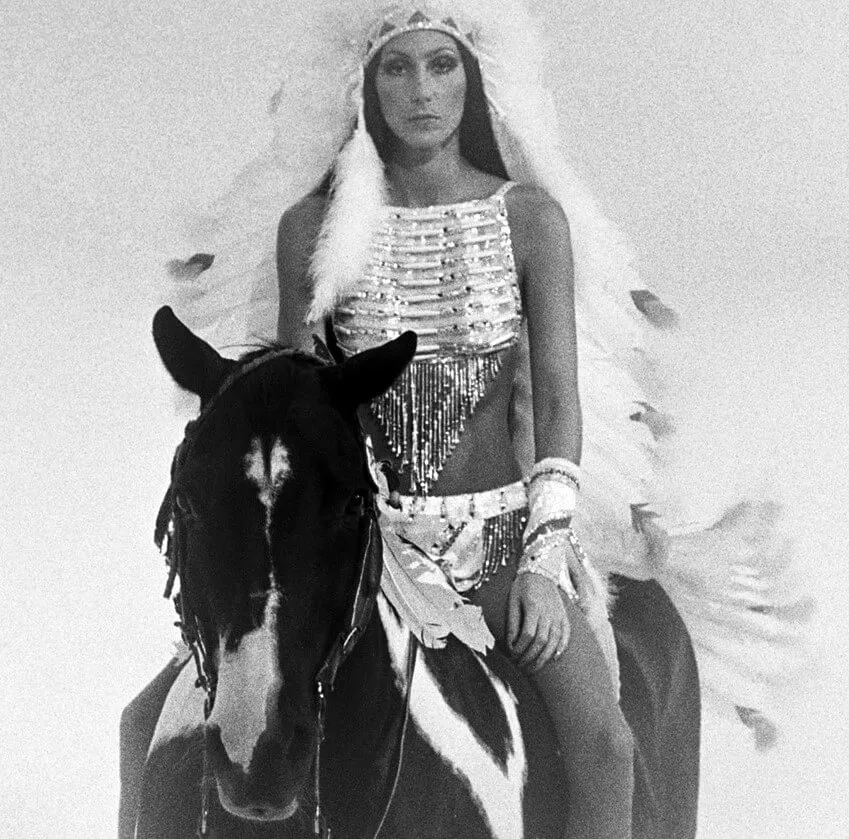 "Half-Breed" singer Cher on horseback