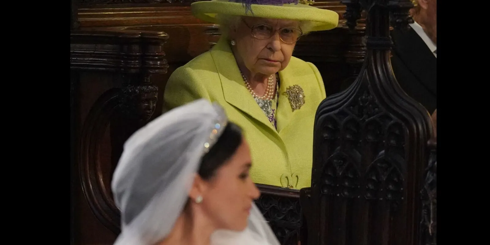 Queen Elizabeth looks at Meghan Markle during her wedding to Prince Harry in 2018