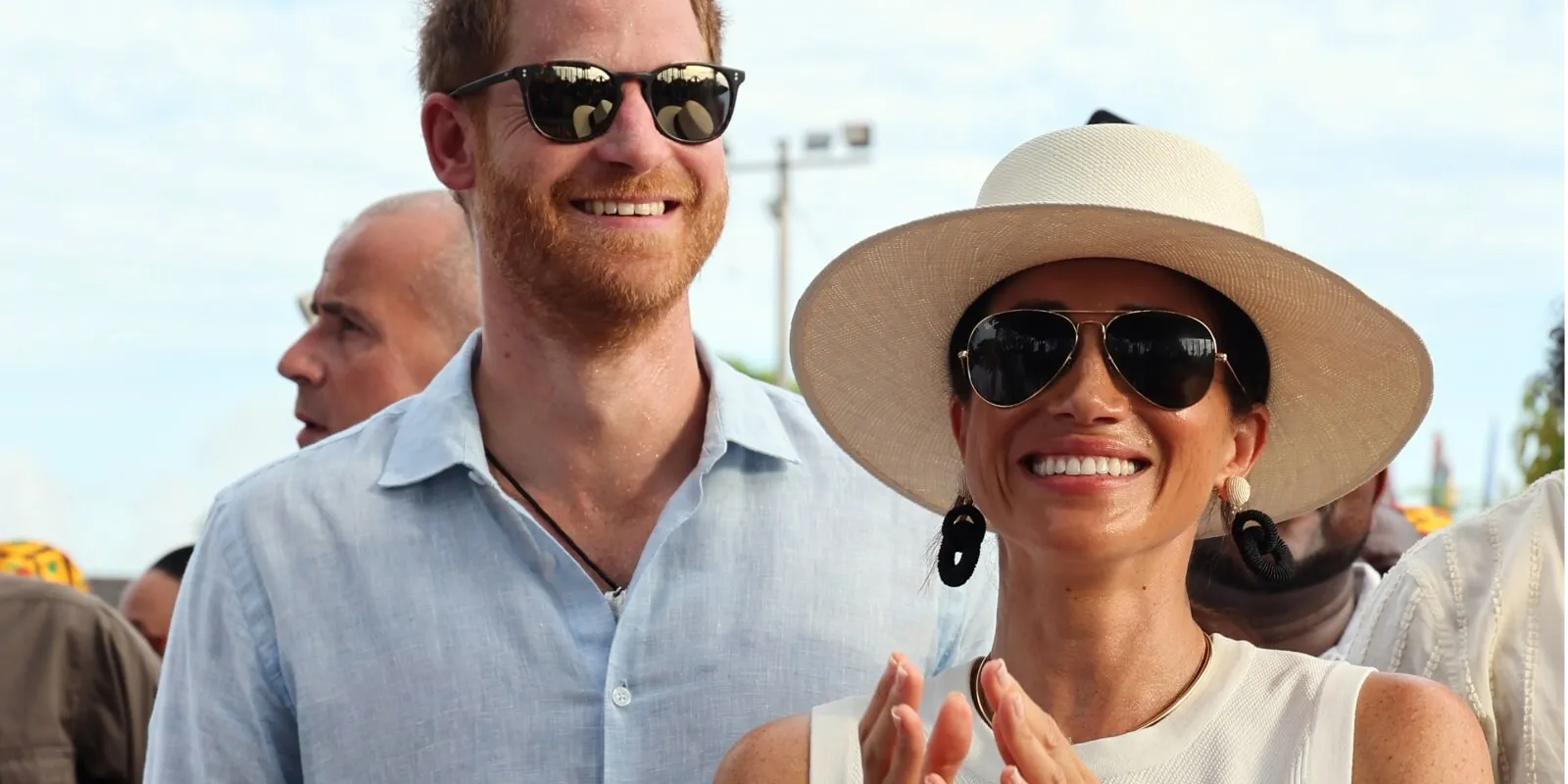 Prince Harry and Meghan Markle smile during a visit to Cartagena, Colombia