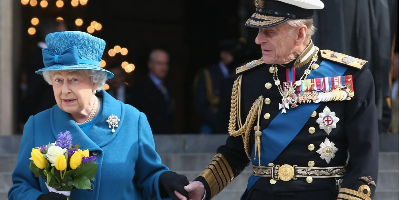 Queen Elizabeth and Prince Philip hold hands in 2015