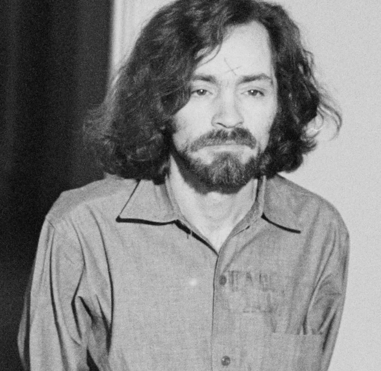 Charles Manson with a "X" on his forehead