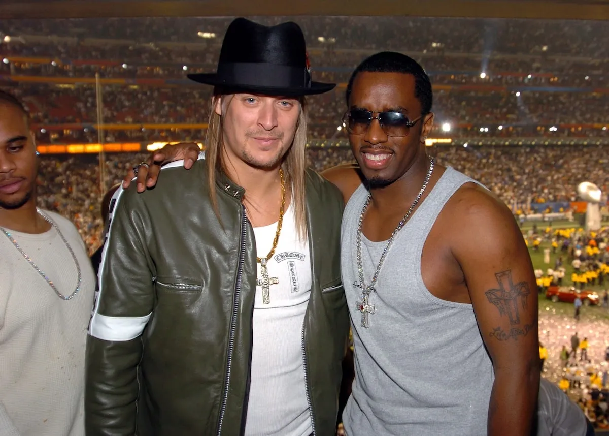 Music artists Kid Rock and Sean Diddy Combs smile together after the 2004 Super Bowl