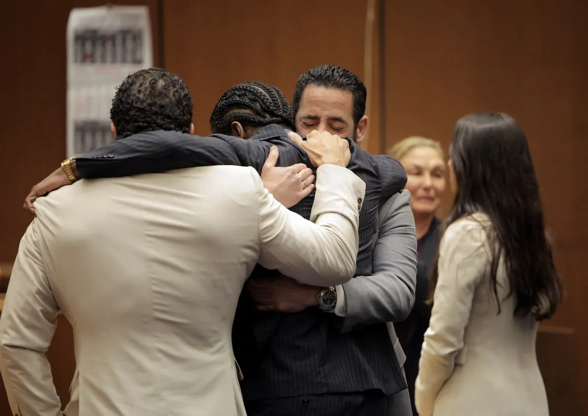 A$AP Rocky hugs his defense attorneys after he's found innocent in court