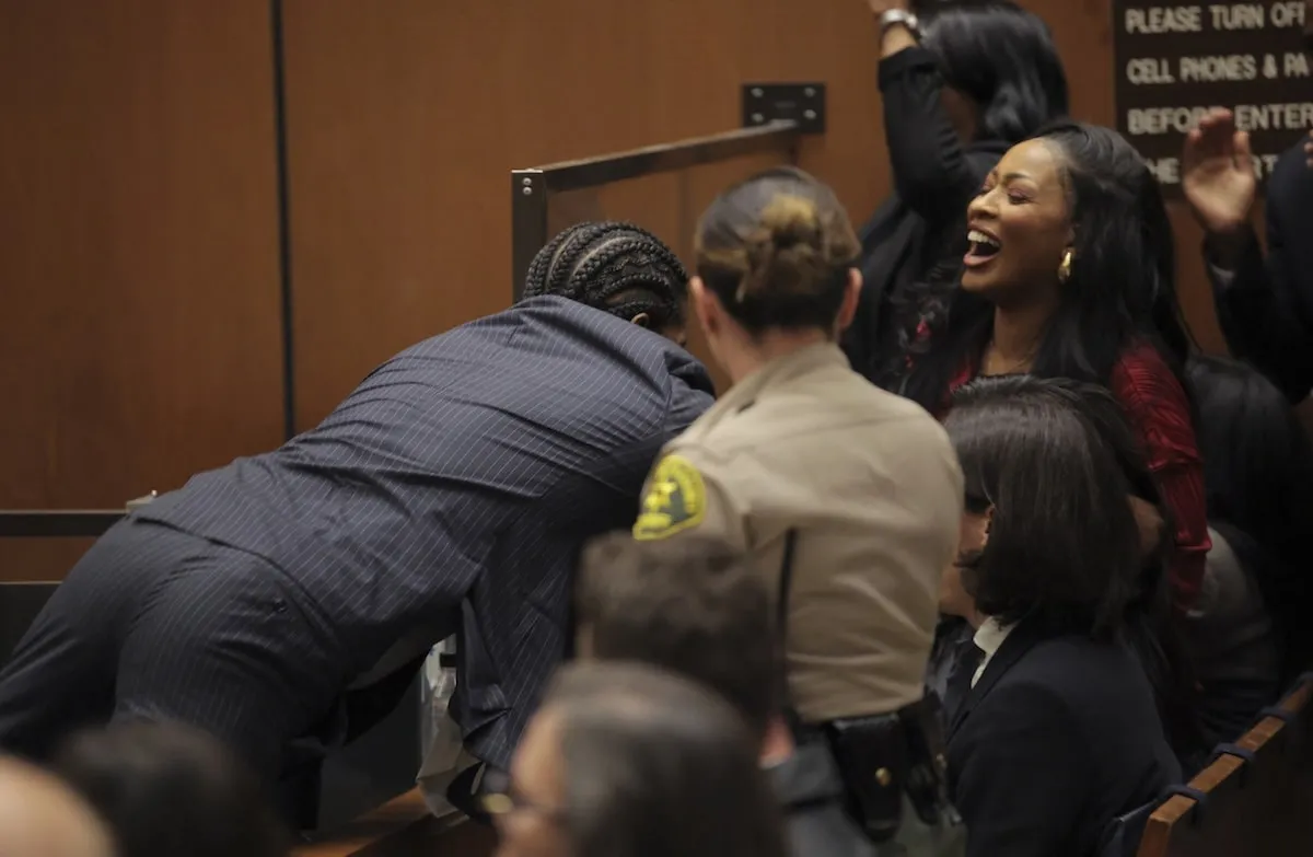 A$AP Rocky hugs his defense attorneys after he's found innocent in court