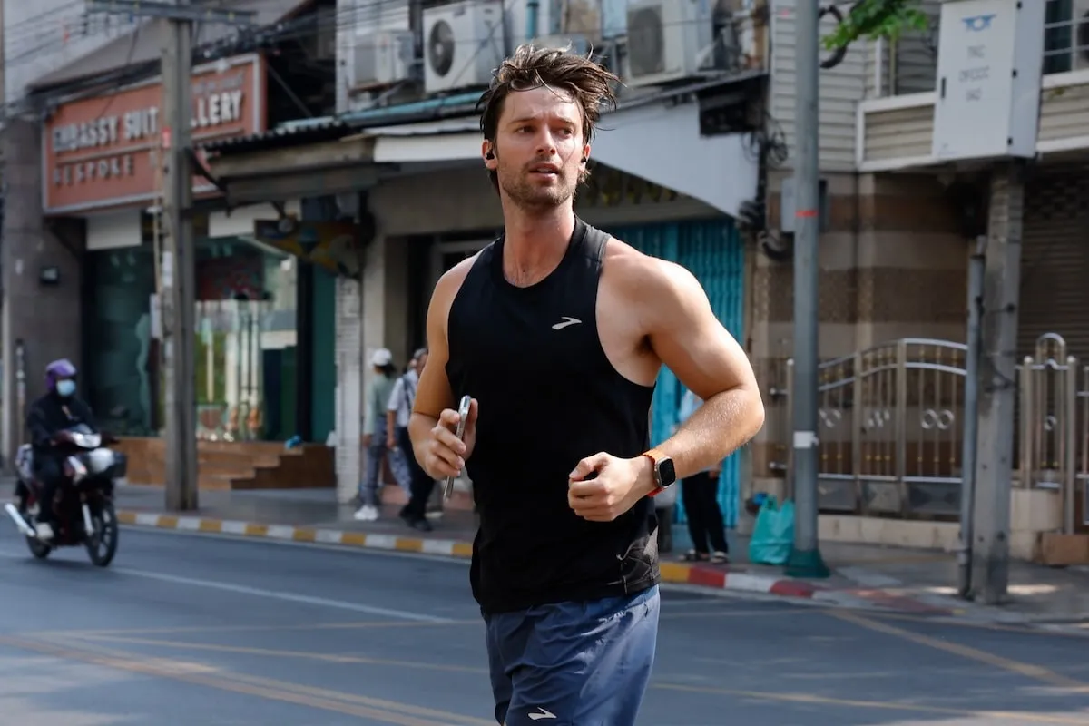 Between press events, Patrick Schwarzenegger goes for a run in Bangkok