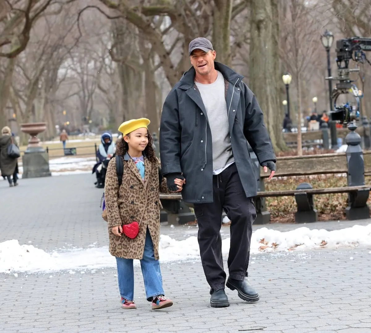 Alan Ritchson holds a girl's hand while walking through Central Park