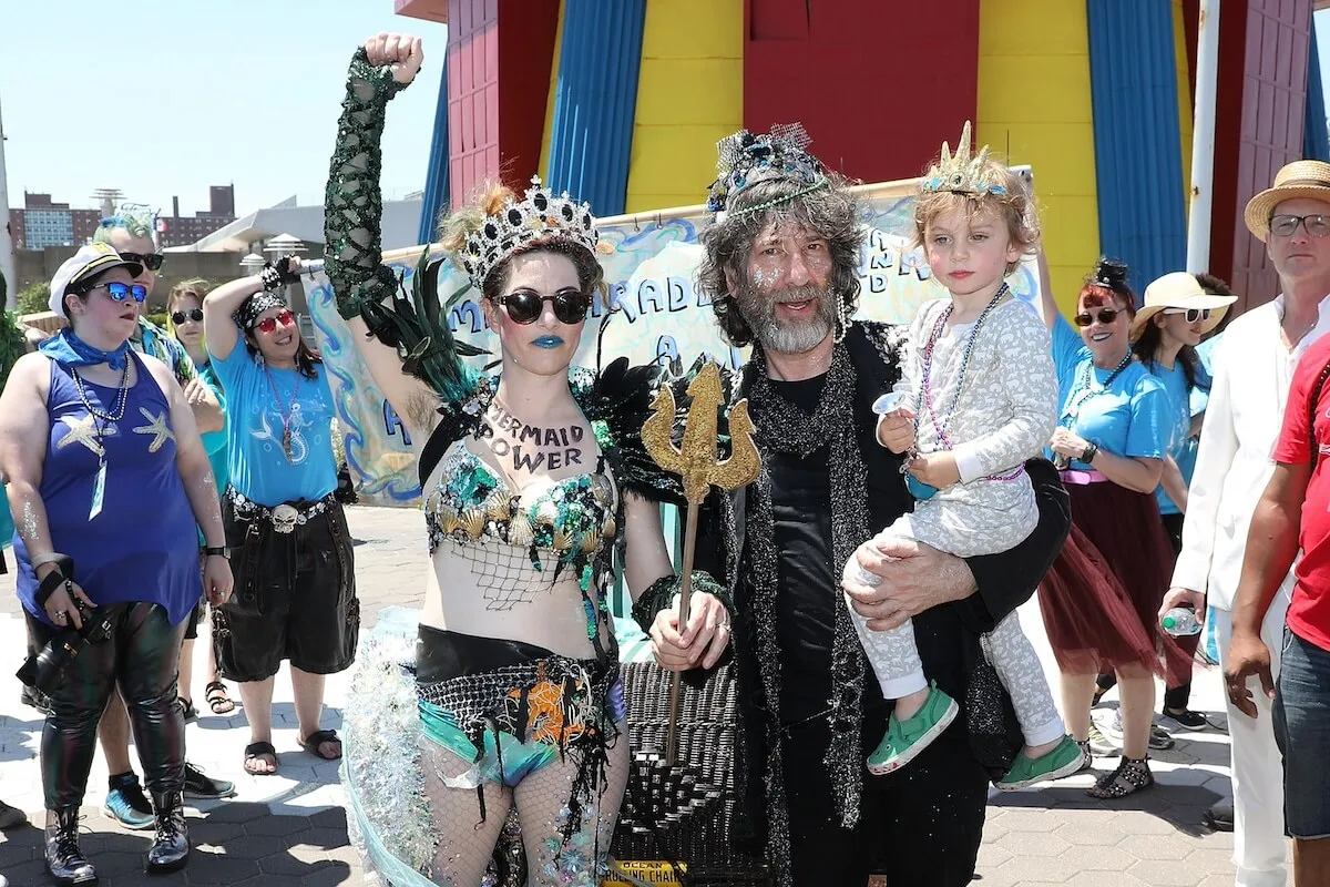 Amanda Palmer and Neil Gaiman (holding their son) at the Mermaid Parade in Coney Island