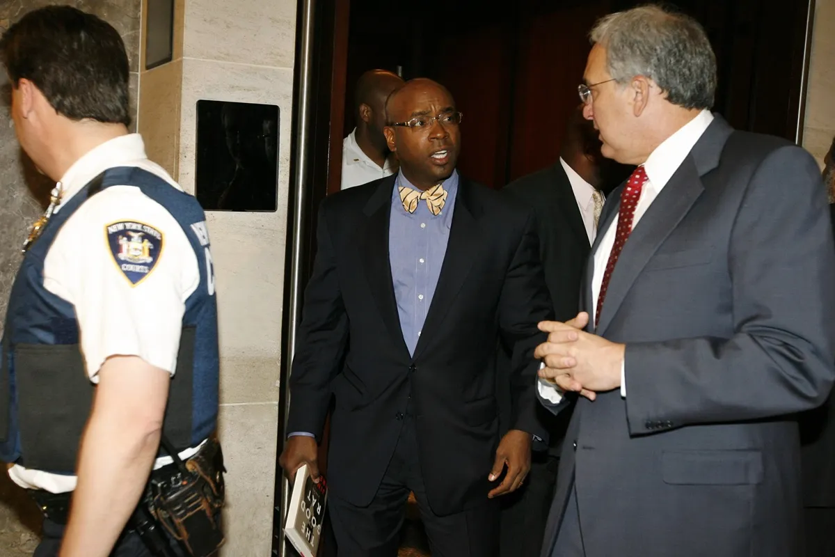 Attorney Anthony Ricco (C) leaves after the not guilty verdict was read by Judge Arthur Cooperman in the Sean Bell shooting trial at the State Supreme Court April 25, 2008 