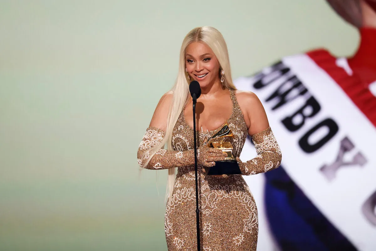 Beyoncé smiles standing on stage after winning the Best Country Album Grammy at the 2025 Grammy Awards