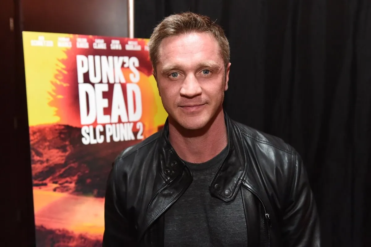 Devon Sawa arrives at the Punk's Dead: SLC Punk 2 premiere event at Megaplex Theaters in a black jacket and shirt.