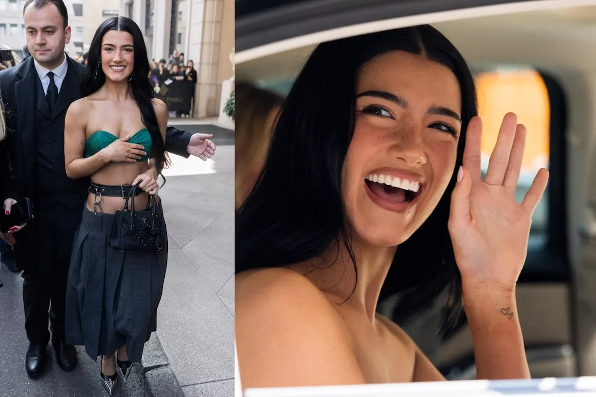 Wearing a green bralette and pleated skirt, Charli D'Amelio smiles at paparazzi and waves at fans after the Milan Fashion Week Womenswear Fall/Winter 2025/26