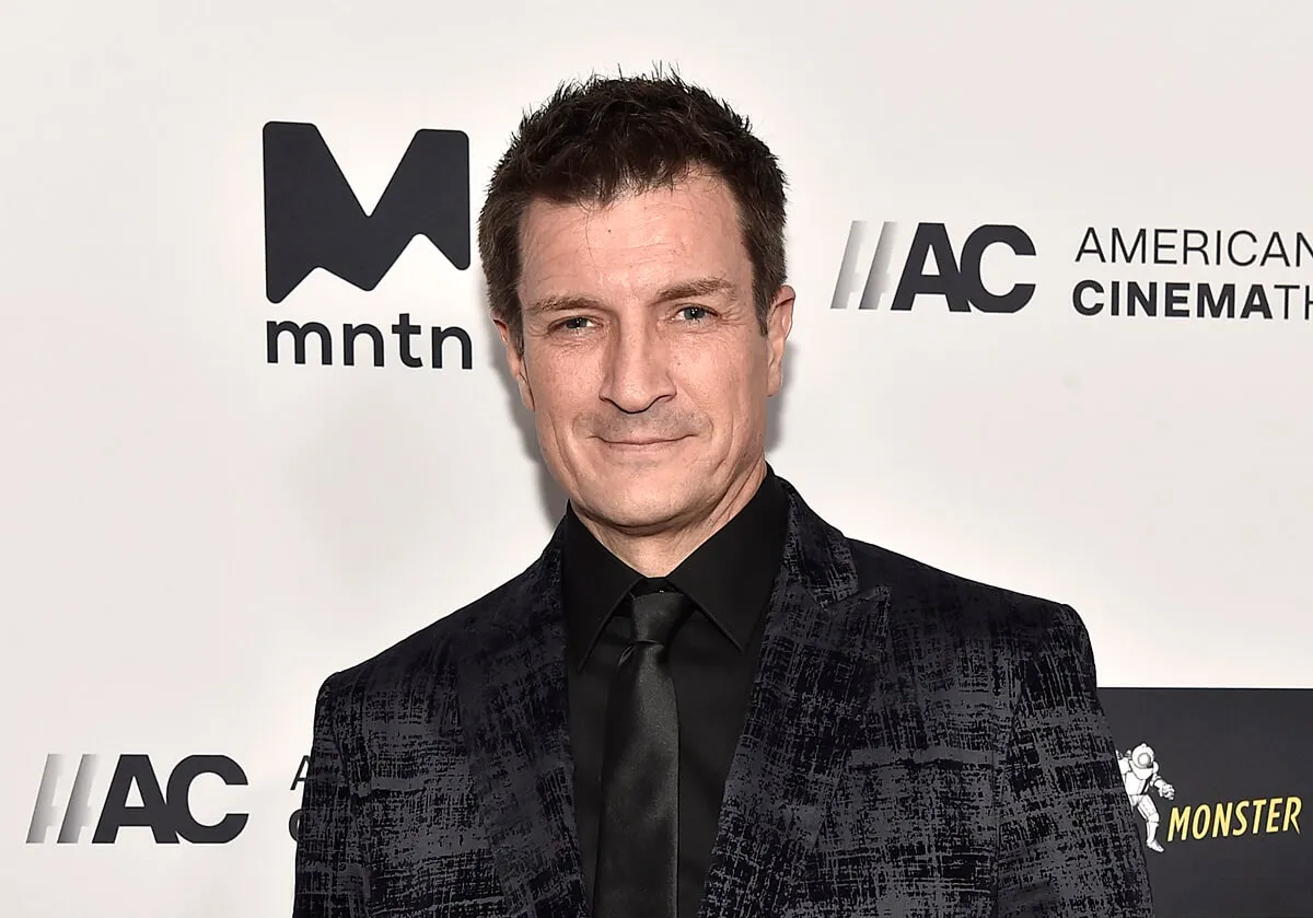 Nathan Fillion posing at the 36th Annual American Cinematheque Award Ceremony honoring Ryan Reynolds.