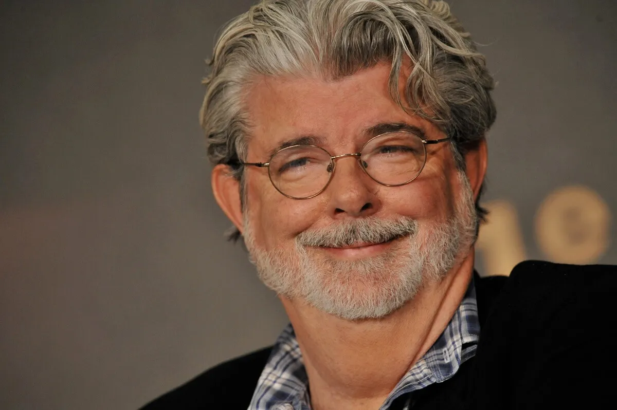 George Lucas smiling at the 'Indiana Jones and the Kingdom of the Crystal Skull' press conference.