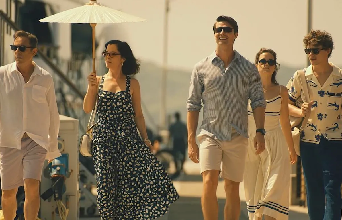 Jason Isaacs, Parker Posey, Patrick Schwarzenegger, Sarah Catherine Hook, Sam Nivola walk down a street in 'The White Lotus' Season 3