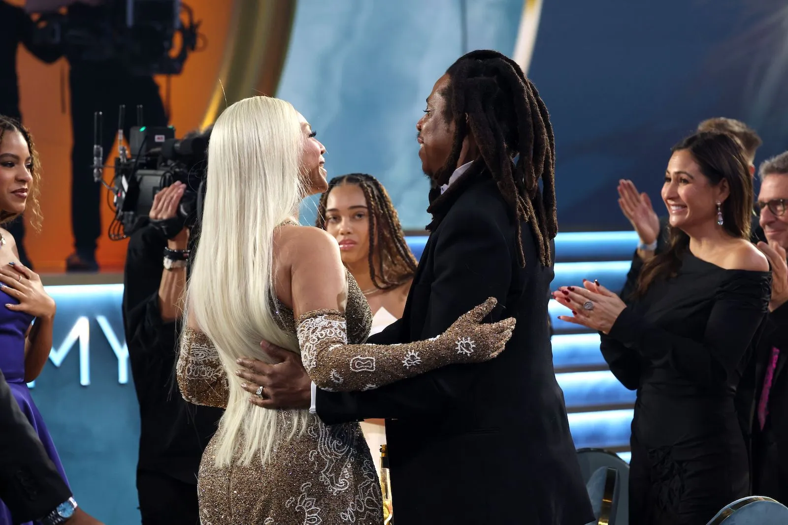 Beyoncé and Jay-Z with their arms around each other's waists at the Grammy Awards