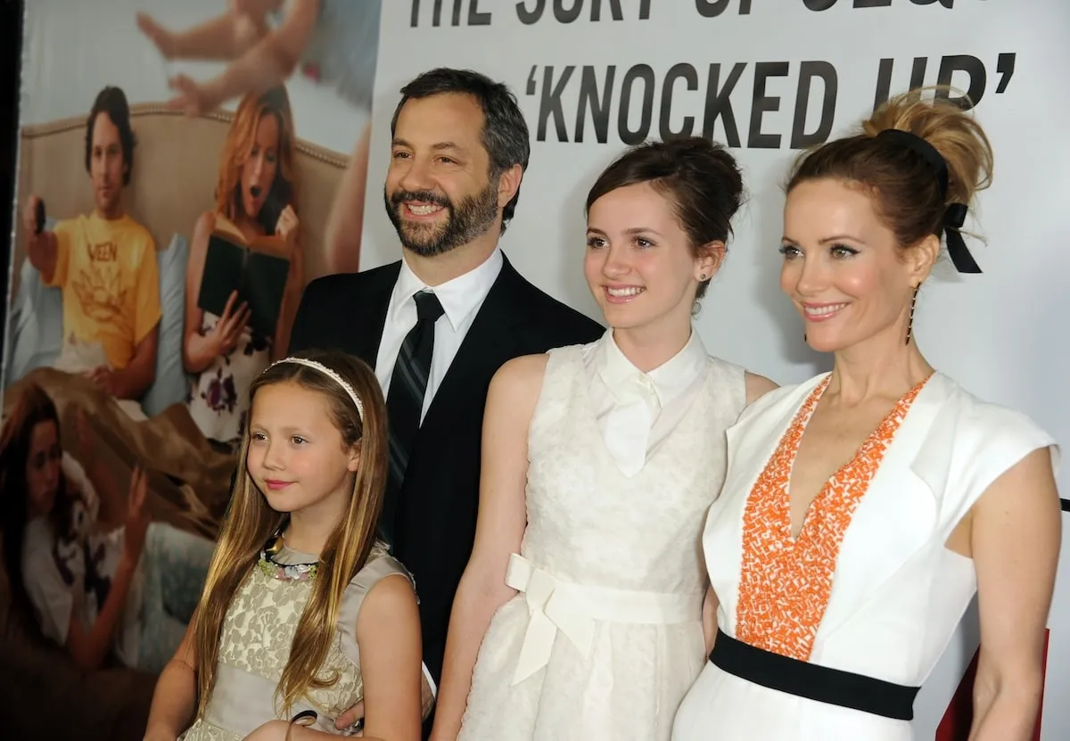 The Apatow-Mann family, including Judd, Leslie, Maude, and Iris, smile on the red carpet at the premiere of This Is 40