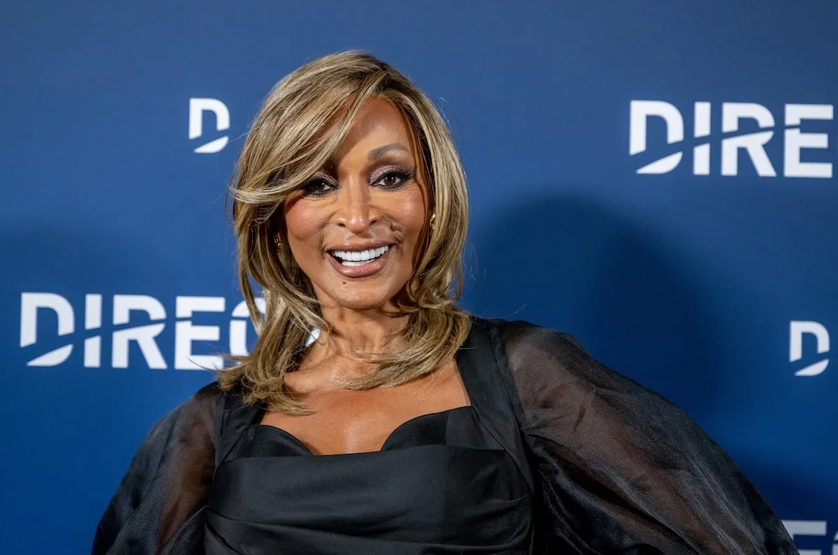 Wearing a black dress, TV personality Karen Huger smiles at a DirecTV event