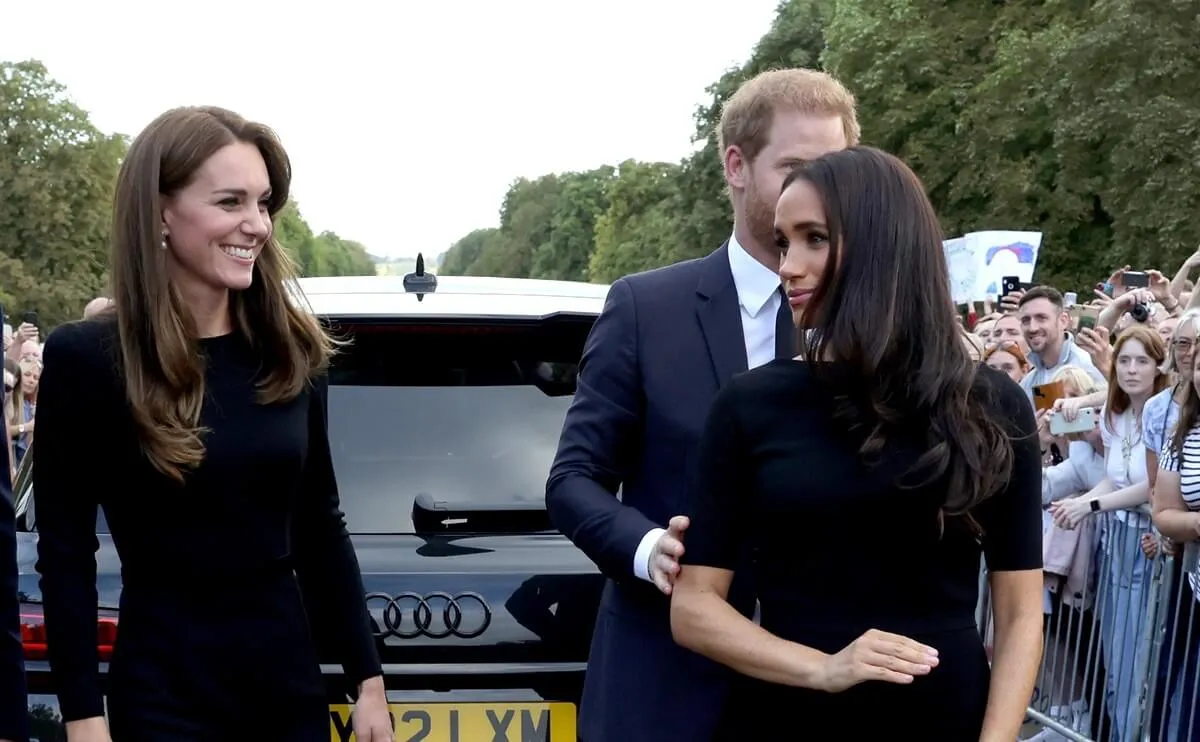 Kate Middleton, Prince Harry, and Maghan Markle arrive on the long Walk at Windsor Castle to view flowers and tributes to Queen Elizabeth II