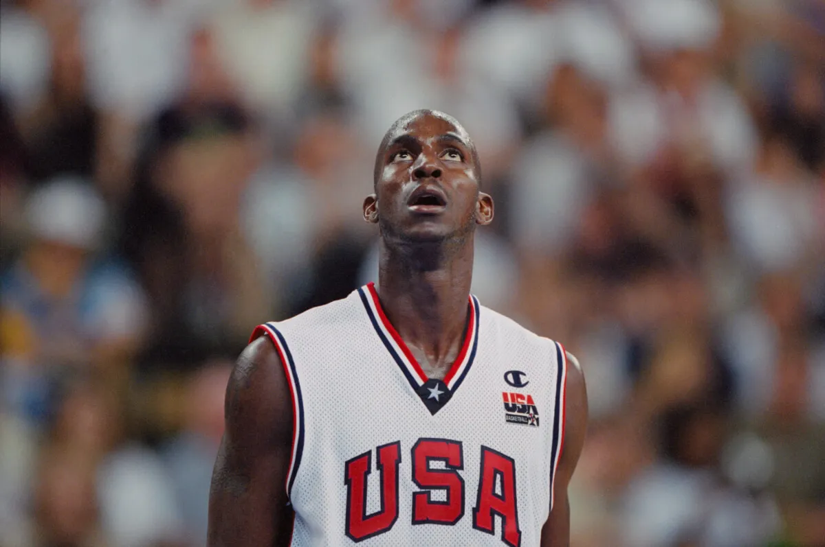 Kevin Garnett wears a USA jersey and looks up.