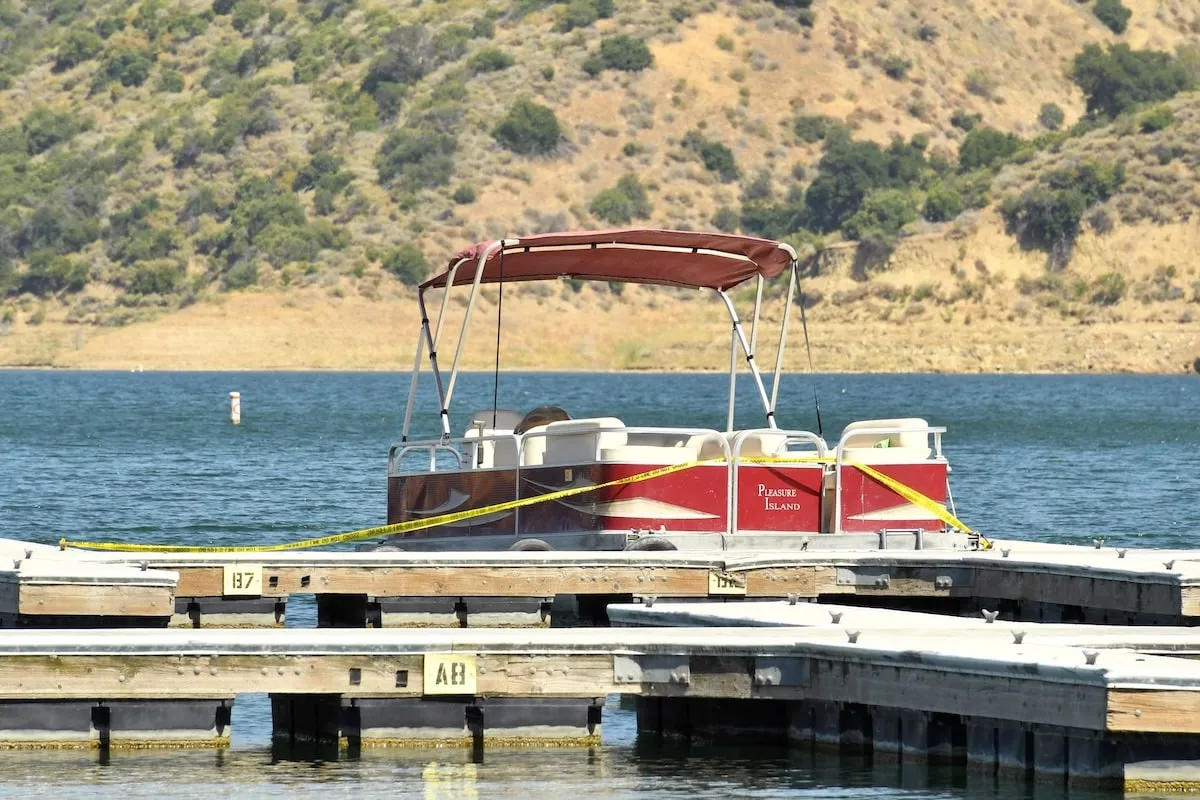 The boat rented by Naya Rivera is docked and roped off with police tape at Lake Piru, where she was reported missing on July 9, 2020