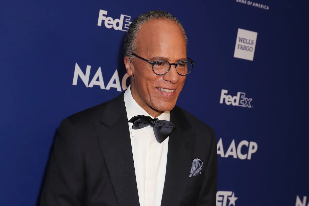 Lester Holt, wearing a tuxedo and round glasses with black frames, at the NAACP Image Awards