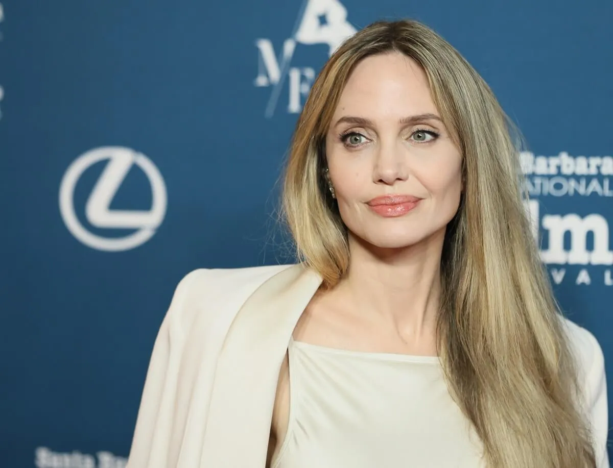 Angelina Jolie posing in a white outfit at the 40th Annual Santa Barbara International Film Festival: Maltin Modern Master Award Honoring Angelina Jolie.