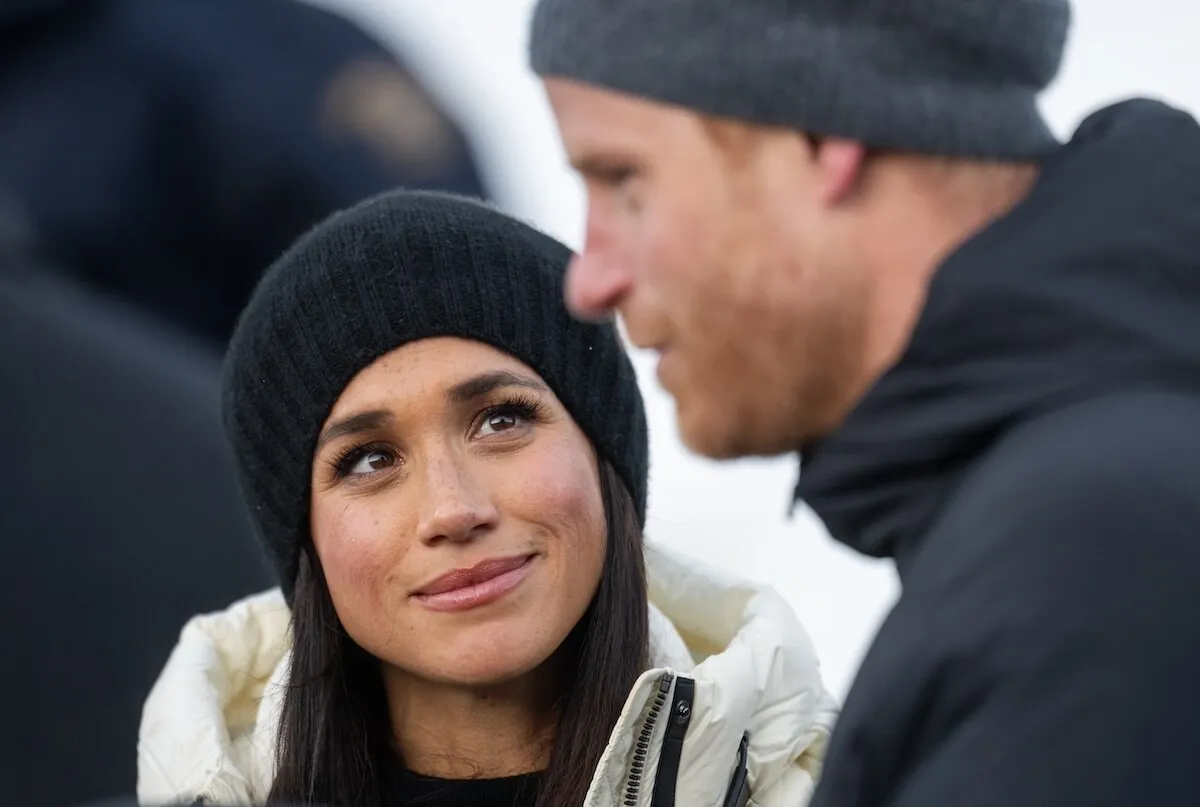 Meghan Markle looks at Prince Harry