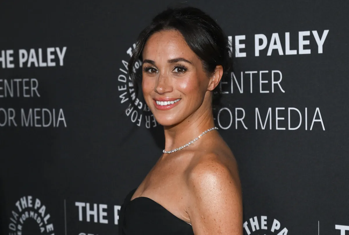 Meghan Markle, who tracked down Billie Eilish merch for teen California wildfires victim, wears a black gown.