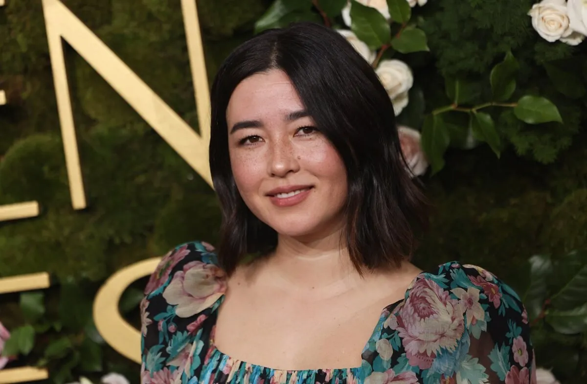 Maya Erskine posing in a dress at the Golden Globe awards.